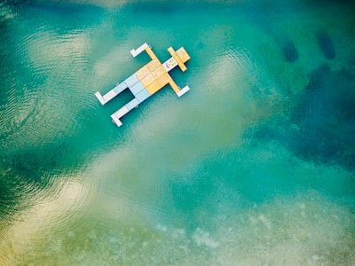 A man floating on a raft in the ocean.